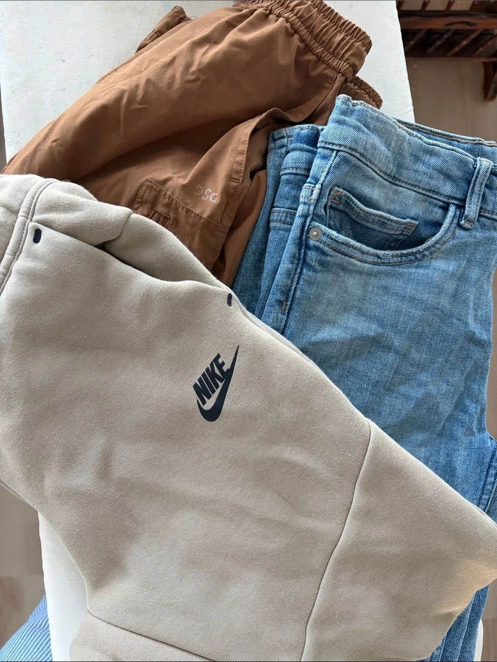 Nike Beige Pants with Light Blue Jeans and Brown Joggers
